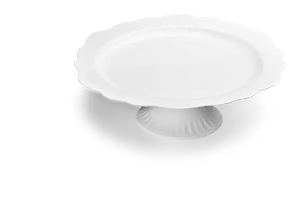 White empty cake plate isolated on white