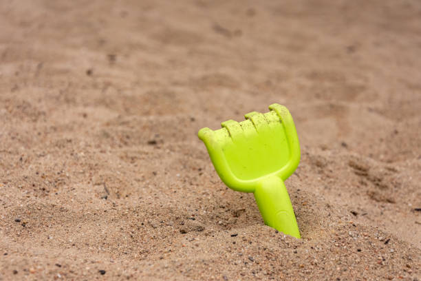 istock a rake in the sand on the beach 1402705713