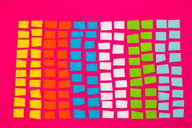 colorful paper blocks, a sheet of chopped paper on a pink background colorful paper blocks, a sheet of chopped paper on a pink background pseudanthias pleurotaenia stock pictures, royalty-free photos & images