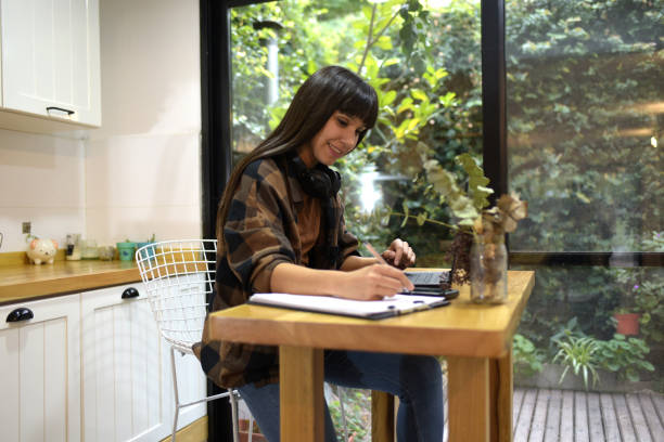 istock young woman working from home 1402709524