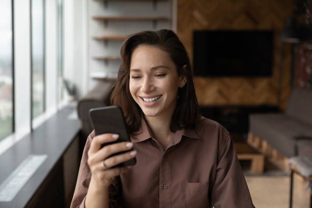 istock Smiling woman have webcam video call on smartphone 1402711592