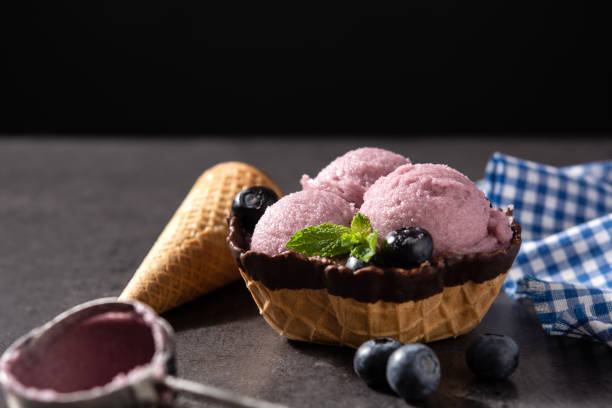 istock Blueberry ice cream scoops with waffle 1402713019