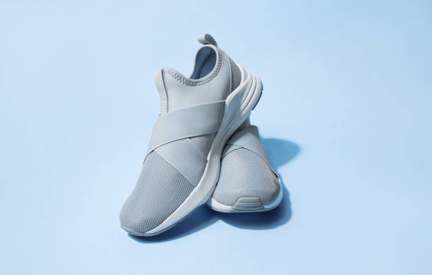 istock Pink pastel color sneakers on background 1402713282