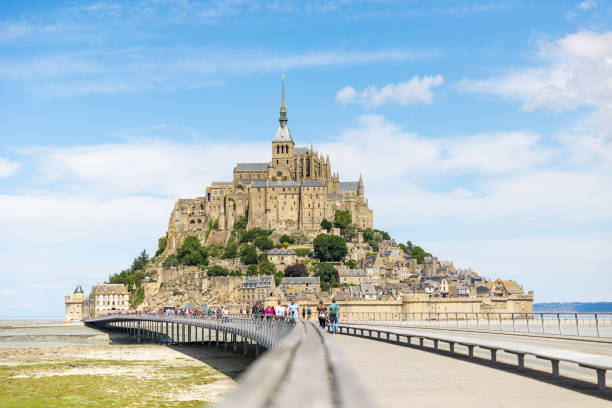 View of Mont Saint-Michel from the footbridge over the bay stock photo