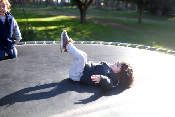 istock children jumping on trampolin 1402721880