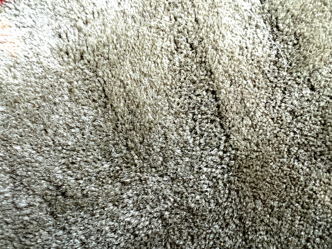 A beige fabric-like image as a texture or background.