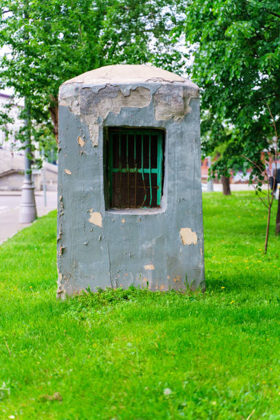 istock Small concrete tower with metal lattice in the grass 1402724381