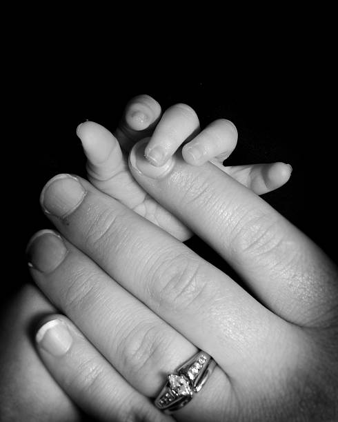 istock Mother and Newborn's Hands 140272487