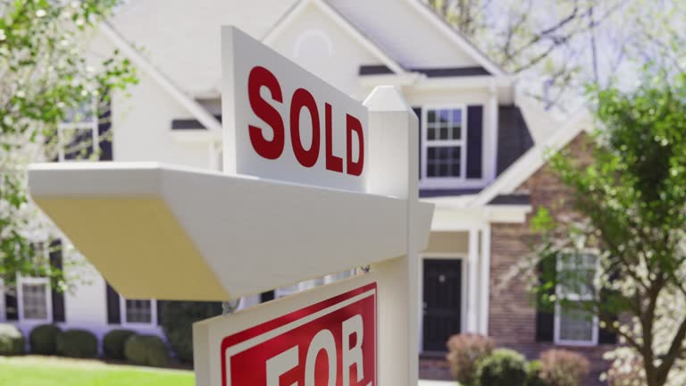 Sold For Sale Real Estate Sign in Front of Property.