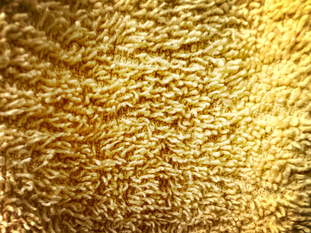 A macro image of a yellow towel. stock photo