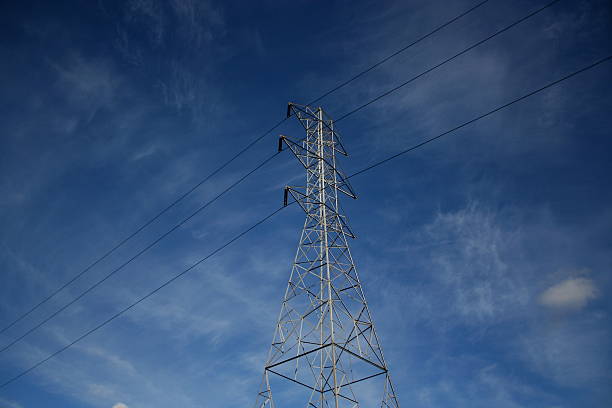 High voltage powerline tower stock photo