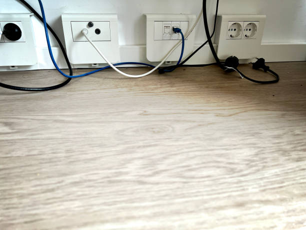 istock Electricity and internet sockets under table with nice light wooden floor. 1402727646