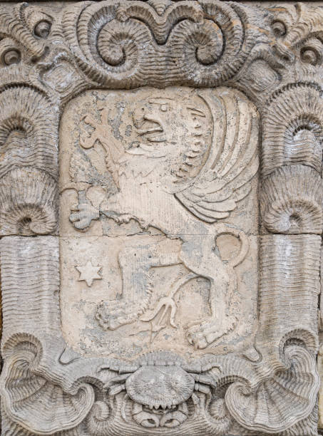 istock Medieval stone bas-relief with heraldic royal lion 1402728533
