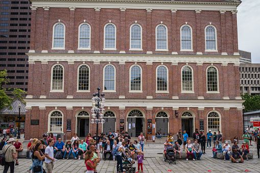 Boston, MA, US-June 11, 2022: Tourists at the landmark Faneuil Hall-Quincy Market food market in downtown Boston.