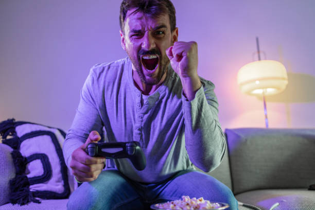 istock Overemotional handsome man winning the video game 1402728896