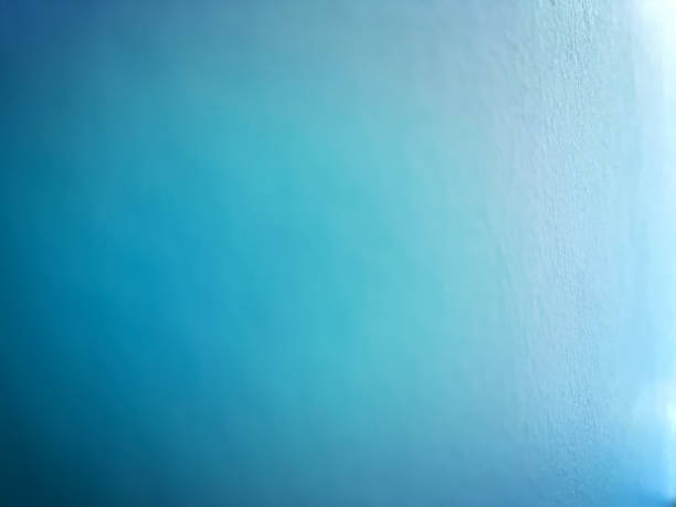 A blurry picture of a blue wall of plaster. stock photo