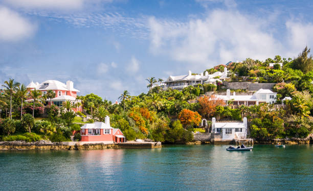 Bermuda Bayside Homes Large and small homes are nestled in the steep but low hills above the water on the outskirts of Hamilton, Bermuda. bermuda stock pictures, royalty-free photos & images