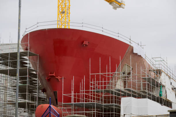 istock Shipbuilding and crane during ferry construction surrounded by scaffold 1402730312