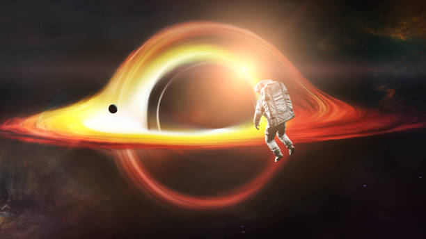 istock Spaceman looks at black hole and planet in deep space. Realistic science fiction art. Elements of this image furnished by NASA. 1402731107