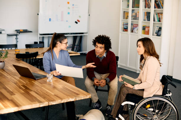 istock Team of entrepreneurs cooperating while analyzing business plan on a meeting in the office. 1402731474
