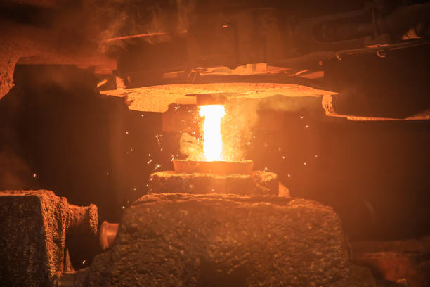 istock Steel pouring from casting ladle into metal molds. 1402732619