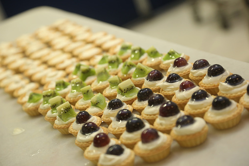 'Mini Tartlets' on the bakery shop table.