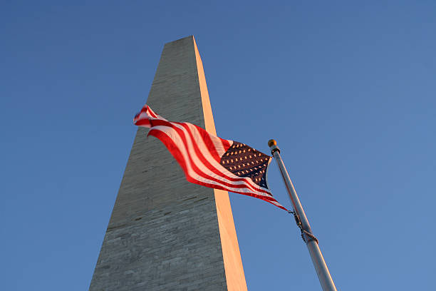 istock Washington monument and American flag 140273350
