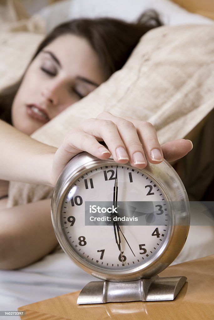 Sleeping Model Release 365  Woman in early waking up to an alarm clock Adult Stock Photo