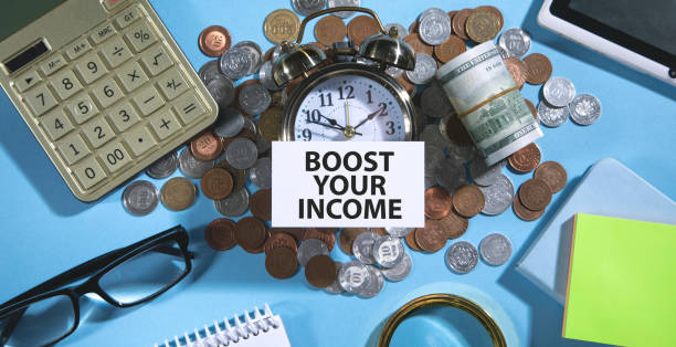 istock Boost Your Income text on credit card with a business objects. 1402735726