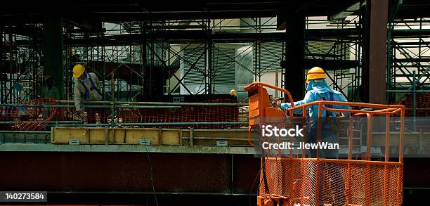 Foto de Trabalhador De Construção e mais fotos de stock de Azul - Azul, Cingapura, Construindo