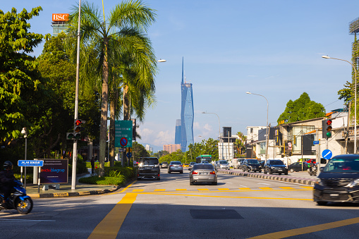 Kuala Lumpur, Malaysia - June 8, 2022: The new second tallest building in the world, Merdeka 118. The new icon behind a busy junction with high traffic. KL118  the heart of the Malaysian capital