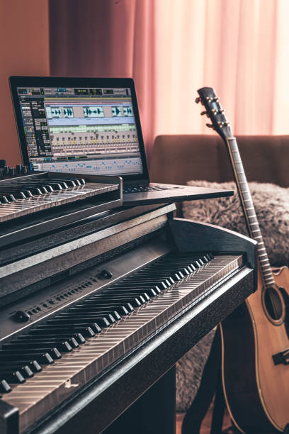 istock Electronic piano and guitar in room interior. 1402737275
