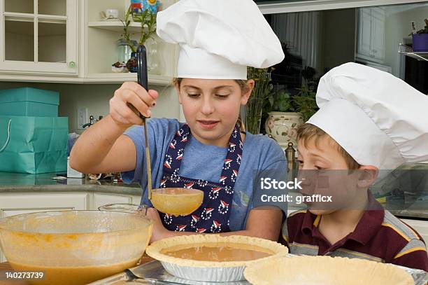 Baking A Pie 5 Stock Photo - Download Image Now - Child, Ladle, Apron