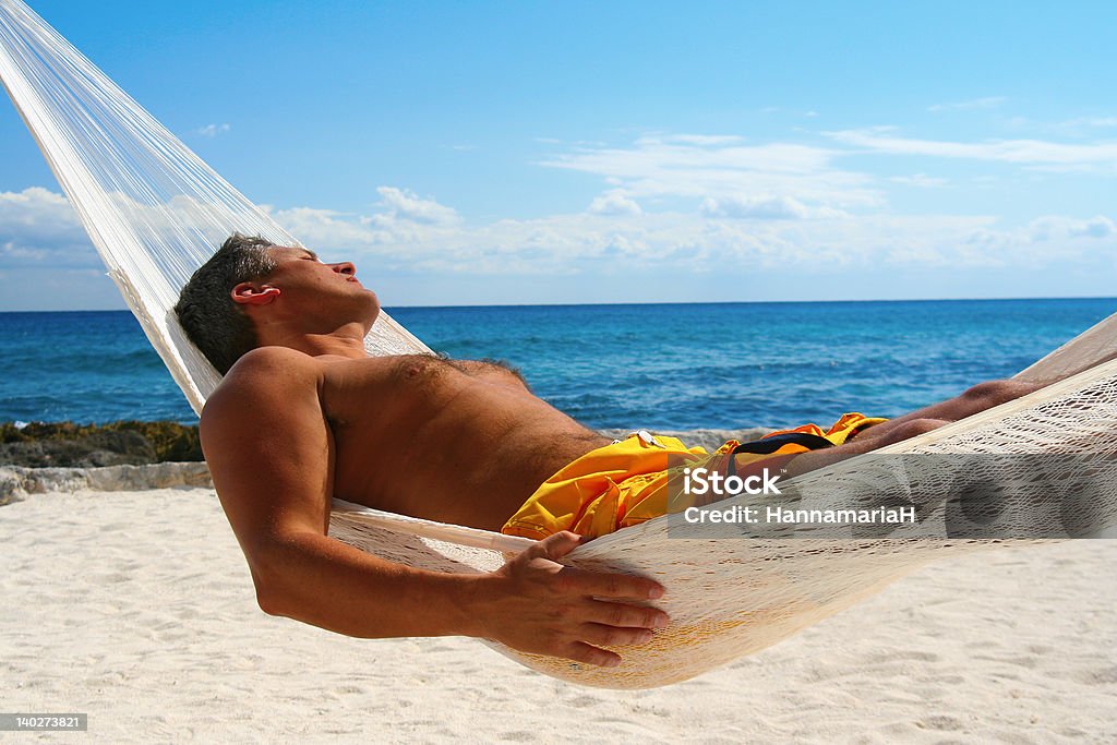 Peace Attractive man asleep in a hammock.  Hammock Stock Photo