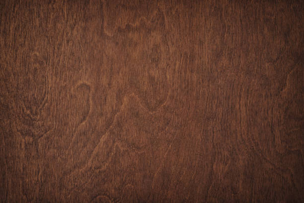 istock brown wooden table, top view. dark board texture 1402738244