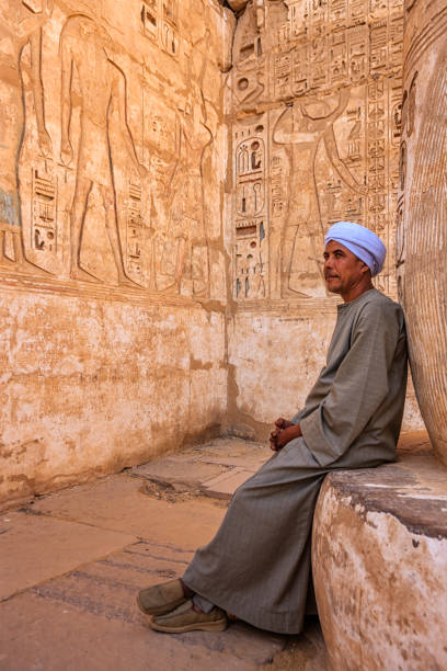 istock Egyptian man resting in ancient temple, Egypt 1402739577