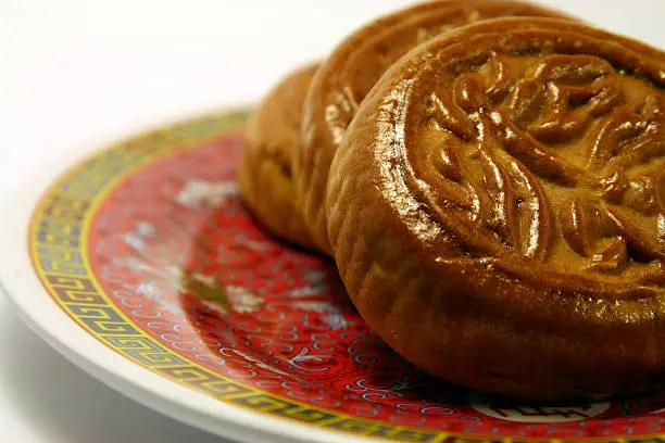 three moon cakes on a plate