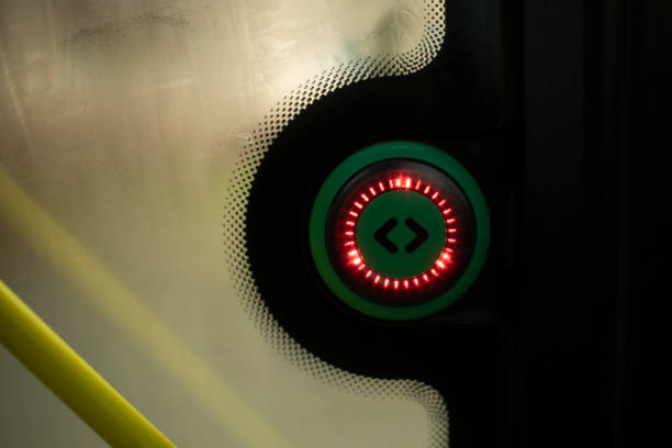 Button on bus. Door opening button. Details in public transport. Door control system.