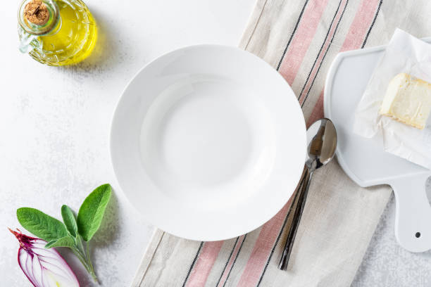 istock set of empty dishes on the table on a white background 1402740496