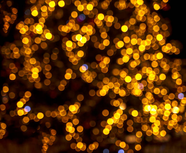 istock Christmas light garland on dark background. Blurred image 1402740871