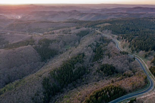 Autosport German race track curves Aerial view of the Nurburgring race track and the natural landscape of the Eifel nürburgring stock pictures, royalty-free photos & images