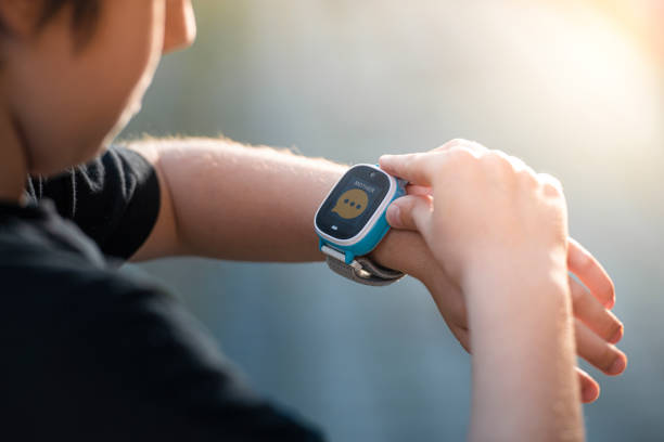 istock Boy calling his mother on his smart watch. 1402742890