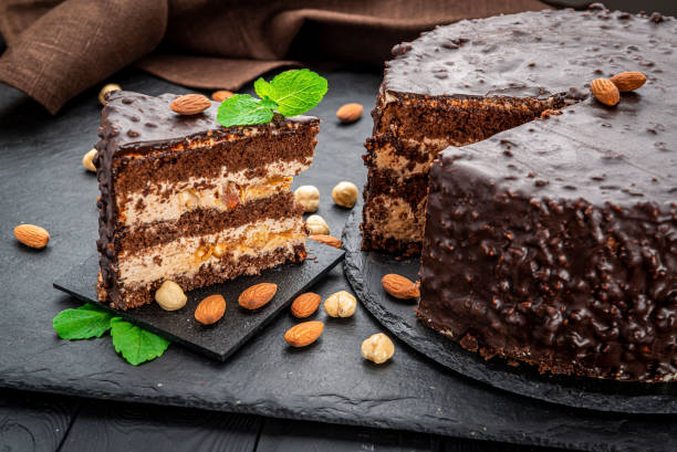 istock Delicious caramel chocolate tart, topped with nuts and hazelnuts, almonds 1402742989