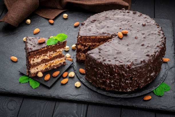 istock Delicious caramel chocolate tart, topped with nuts and hazelnuts, almonds 1402742990