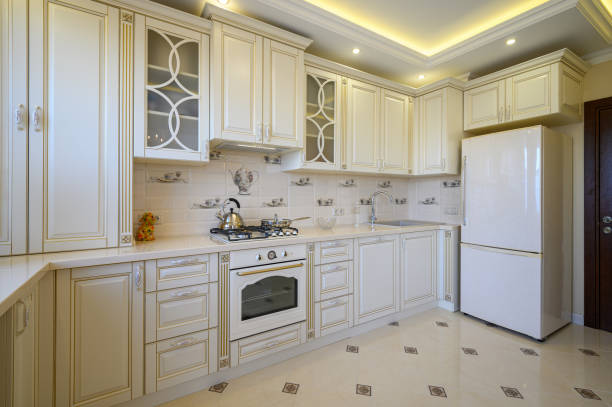 istock Classic white and beige large luxurious kitchen in studio apartment 1402743099
