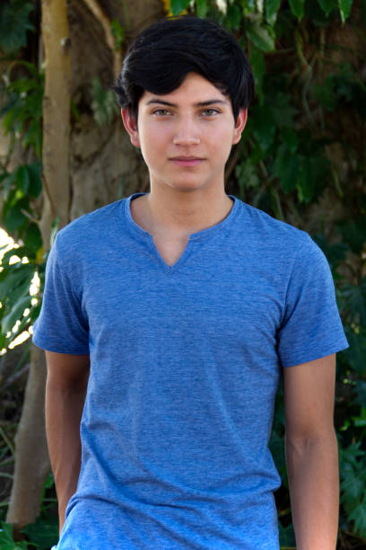 Young male fashion model posing outdoors