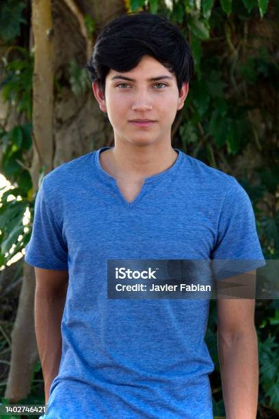 Teenager Boy Looking At The Camera Stock Photo - Download Image Now - Teenage Boys, 18-19 Years, Mexican Ethnicity