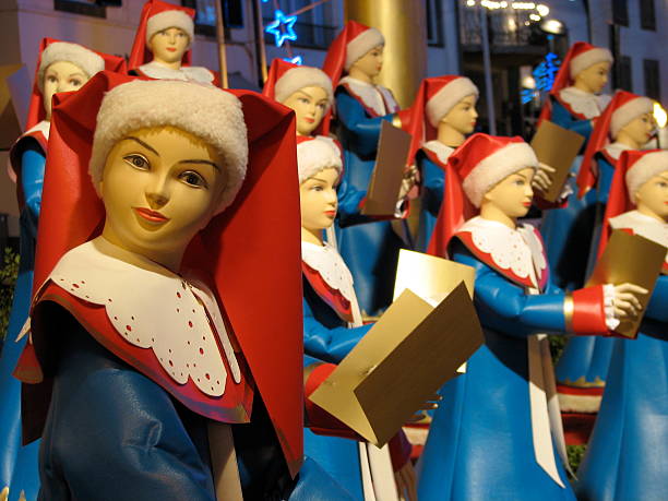 Christmas Choir An ensemble of dummies representing a choir, located in downtown Funchal, Madeira as part of the Christmas decorations. funchal christmas stock pictures, royalty-free photos & images