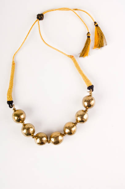 istock golden necklace isolated on white background 1402748468