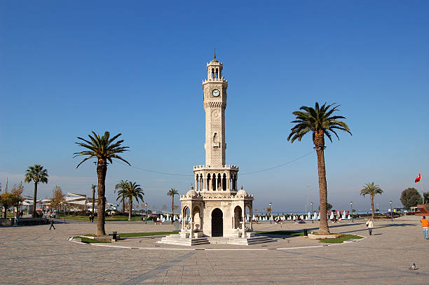 Izmir clock tower with palm trees Historical Clock Tower of Izmir,Turkey. It was built in 1901, at Konak Square and accepted as the symbol of Izmir City. clock tower stock pictures, royalty-free photos & images
